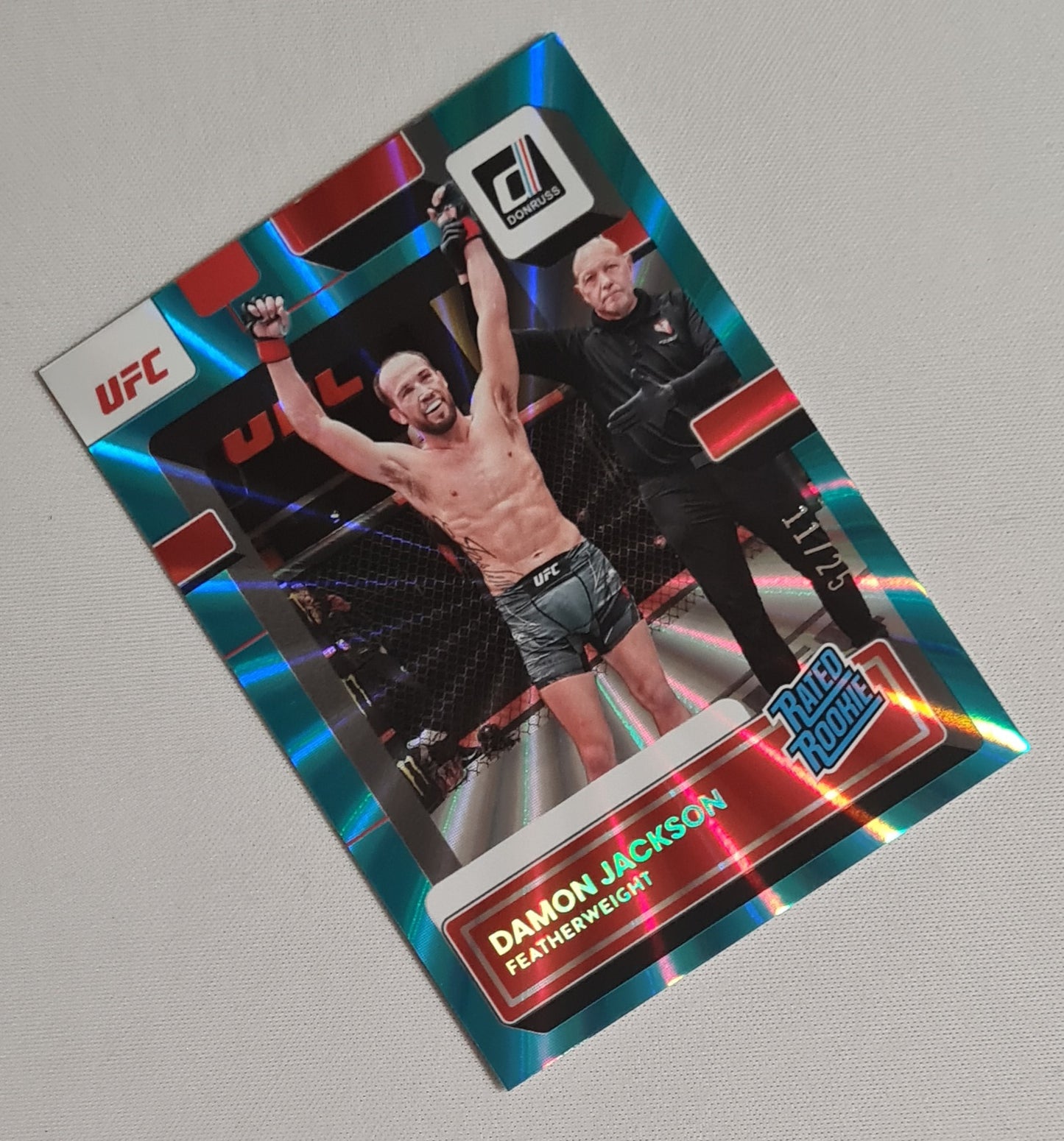 Damon Jackson - 2023 Panini Donruss UFC Fighter Featherweight Rated Rookie #215 Aqua Laser /25
