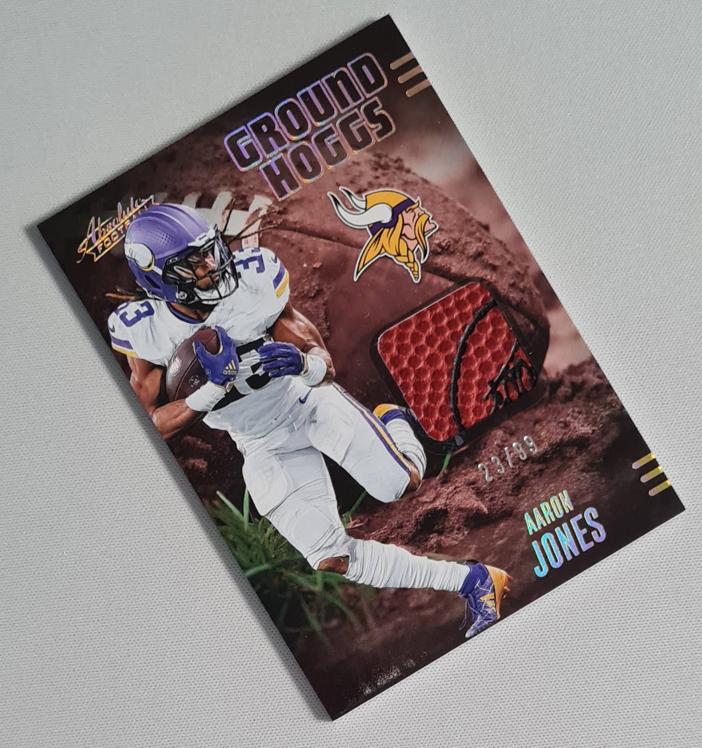 Aaron Jones - 2025 Panini Absolute Football NFL Vikings GROUND HOGGS #GHM-AJO /Relic Memrobilia /99