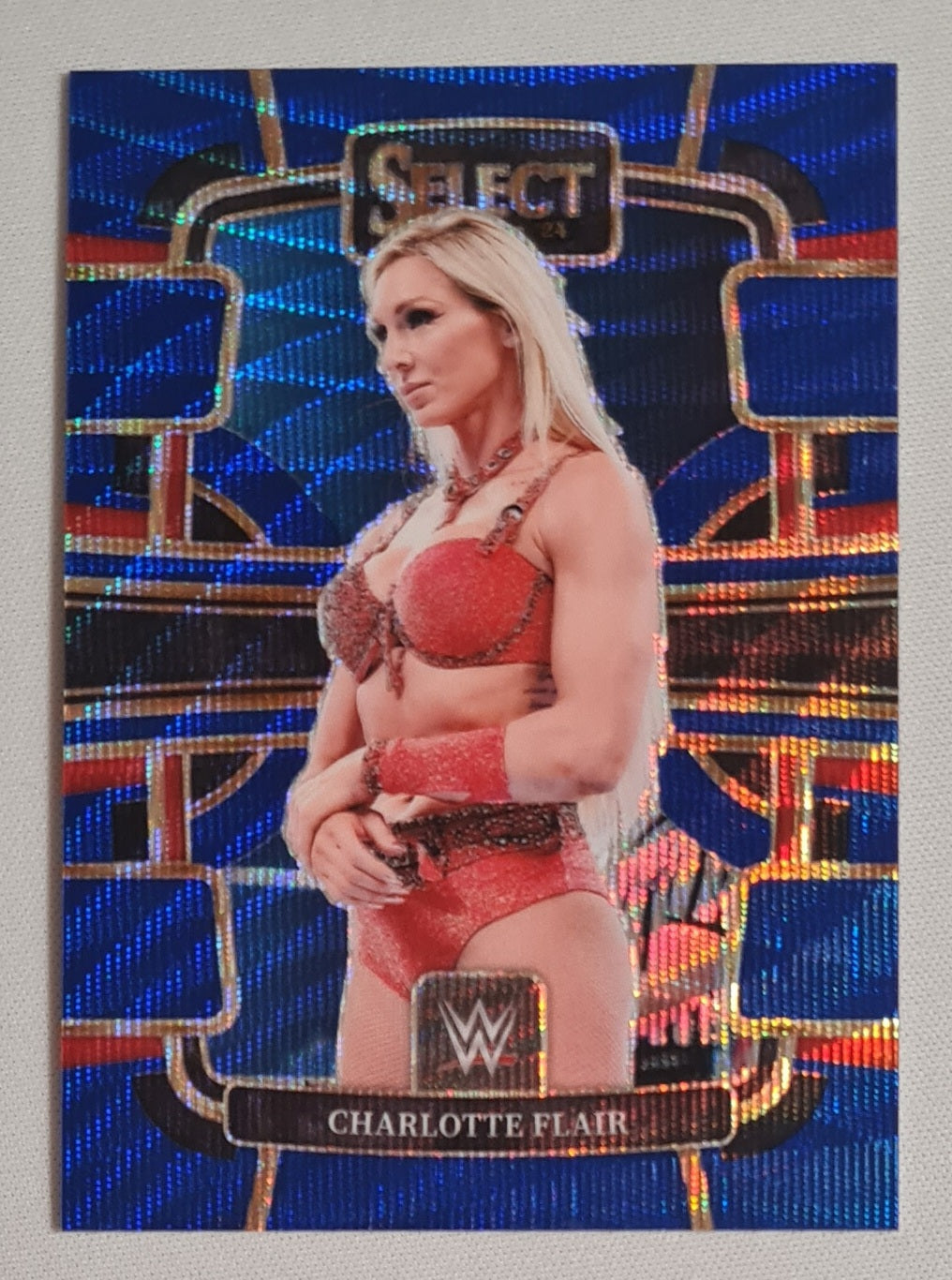 Charlotte Flair - 2024 Panini Select WWE Wrestling Women Division #66 Blue Concourse Prizm /49
