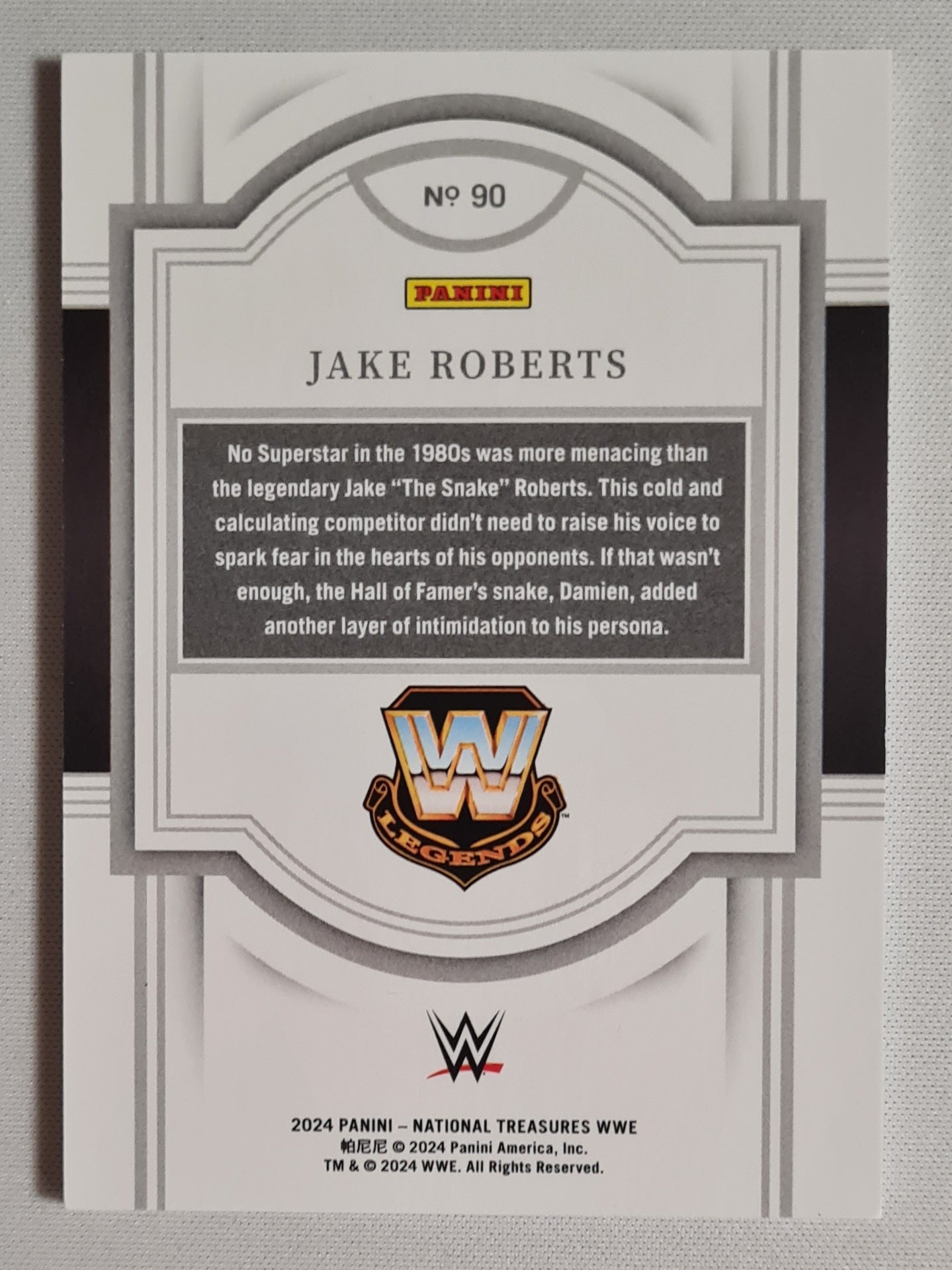 Jake Roberts - 2024 Panini National Treasures WWE Wrestling #90 Red Foil Parallel /75