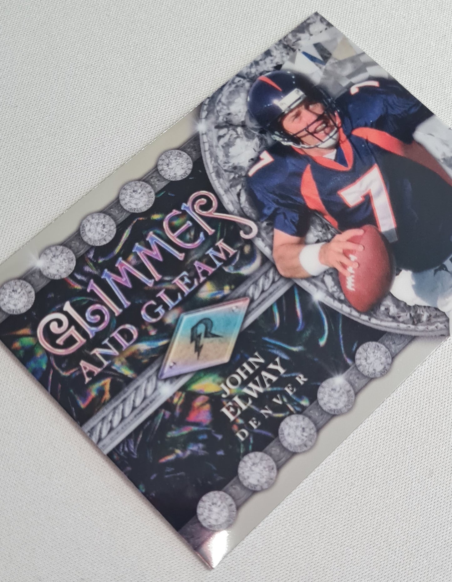 John Elway - 2025 Topps  Football NFL Denver Broncos - Glimmer and Cleam - #GG-3
