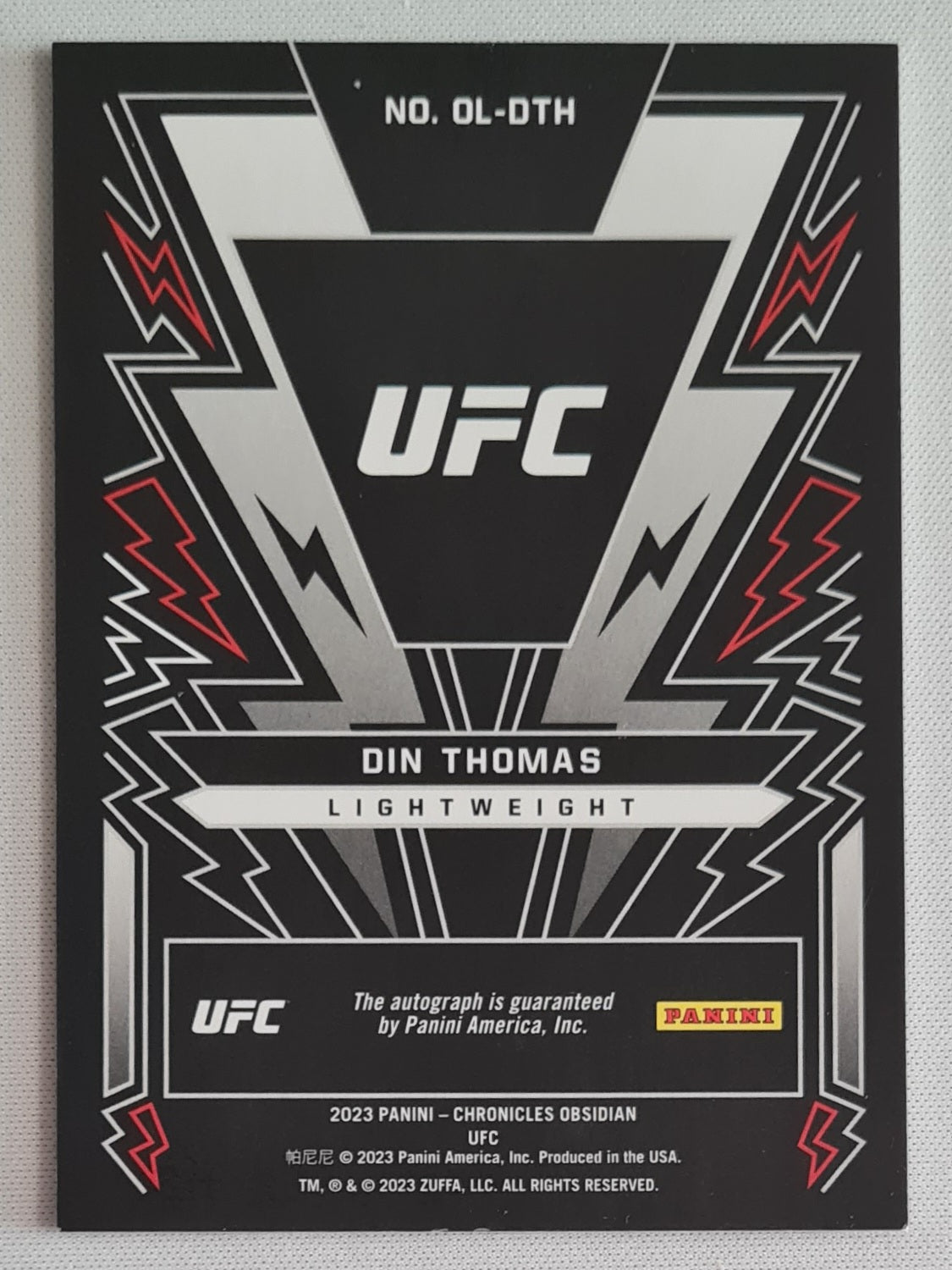 Din Thomas - 2023 Panini Chronicles Obsidian UFC Fighter Lightweight #OL-DTH /Auto