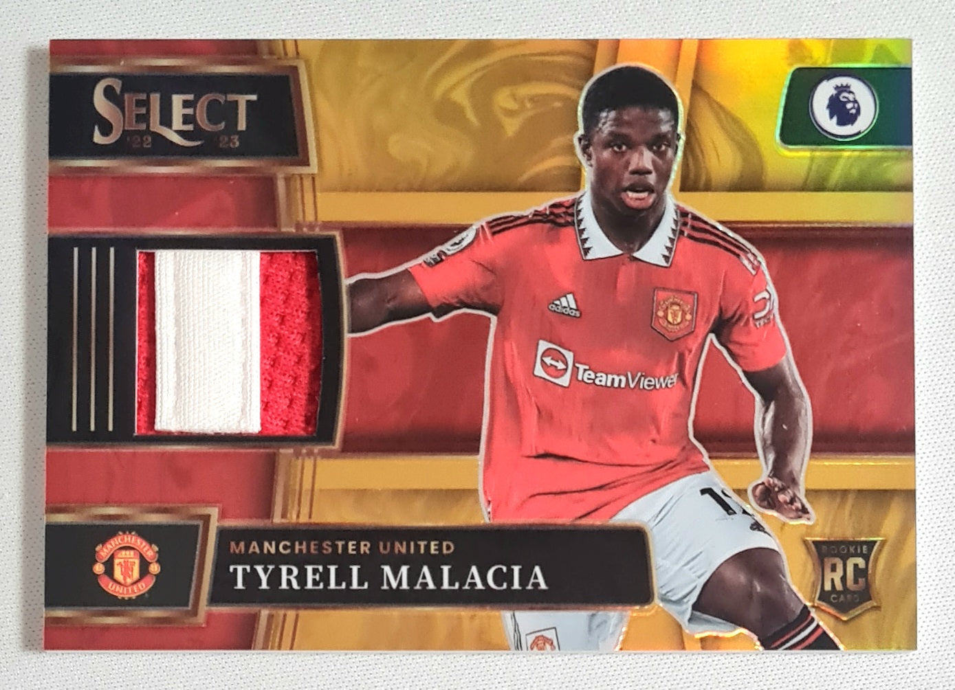 Tyrell Malacia - 2022/23 Panini Select Premier League Soccer Prizm Manchester United #SM-TMA /Patch /10