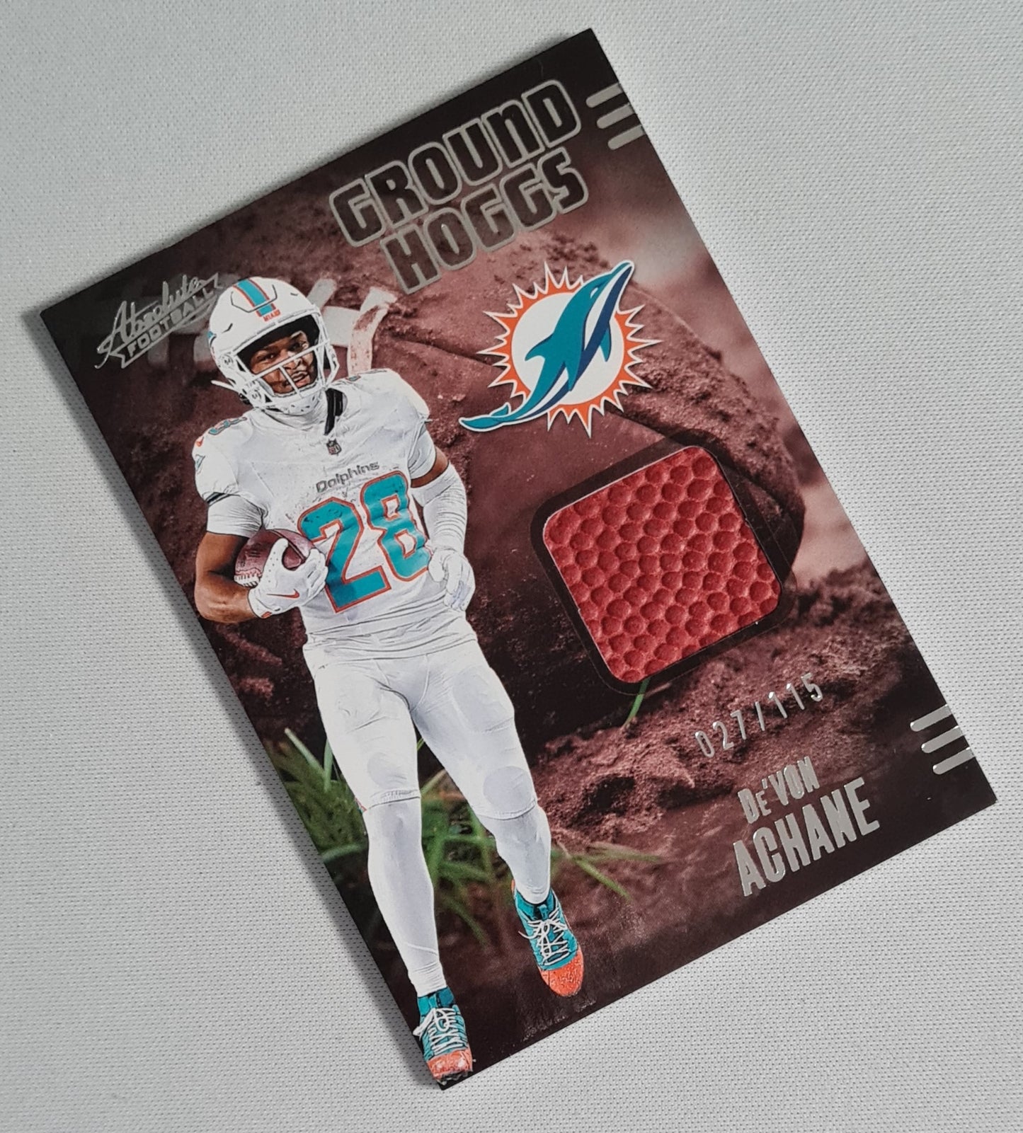 De'Von Achane - 2025 Panini Absolute Football NFL GROUND HOGGS Miami Dolphins #GHM-DAC /115 /Relic Memorabilia