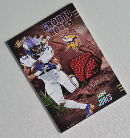 Aaron Jones - 2025 Panini Absolute Football NFL Vikings GROUND HOGGS #GHM-AJO /Relic Memrobilia /99