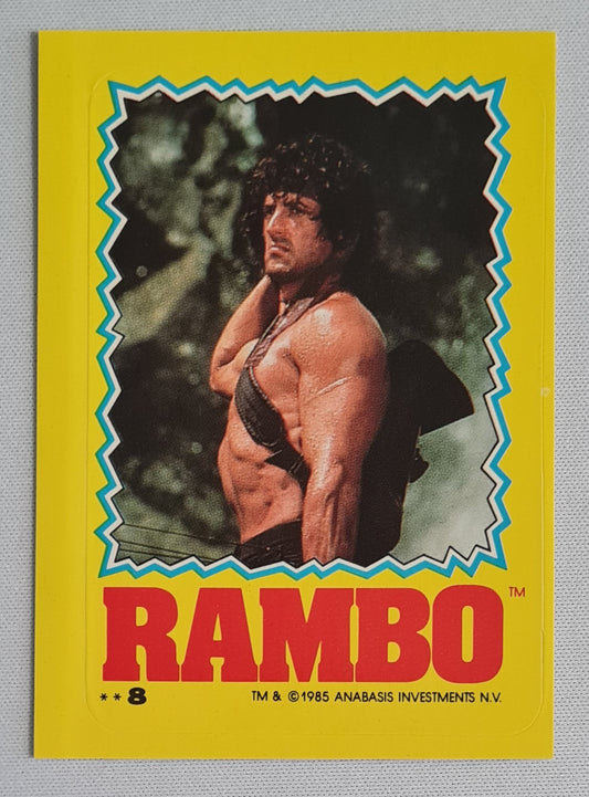 Rambo - 1985 Topps Sticker Card ANABASIS INVESTMENTS N.V. Sylvester Stallone #8